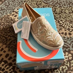 Brand new slip on embroidered Baretraps sneaker.